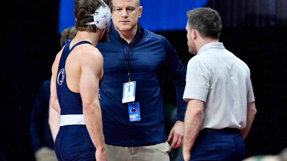Penn State wrestling coach Cael Sanderson talks to Bo Pipher during his bout in the first round of the Big Ten Wrestling championships at Rutgers on Saturday, March, 7, 2020.