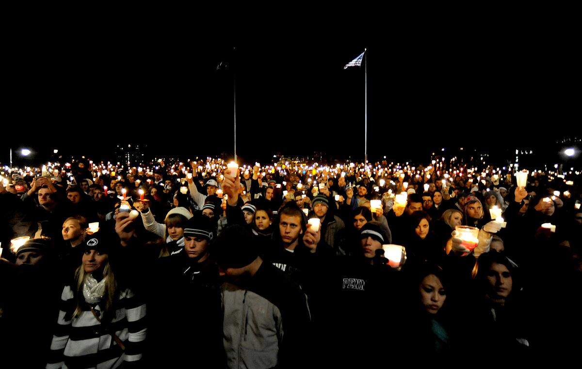 Thousands of students, community members, and Penn State fans fill the Old Main lawn for the candle light vigil held to show support for the victims of the Sandusky sexual abuse scandal on Friday, November 11, 2011. CDT/Abby Drey
