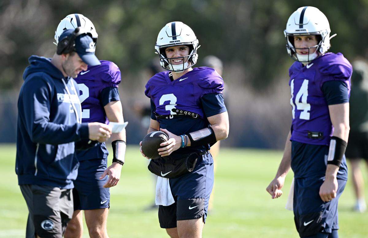 Penn State quarterback Rocco Becht laughs with teammates during practice on Thursday, April 9, 2026.  