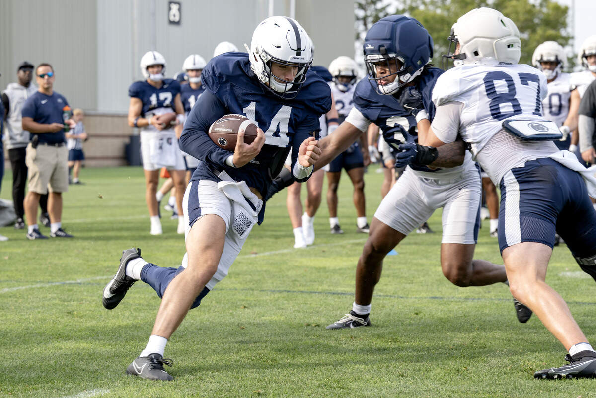Penn State quarterback Jaxon Smolik runs a drill during practice on Saturday, Aug. 2, 2025.