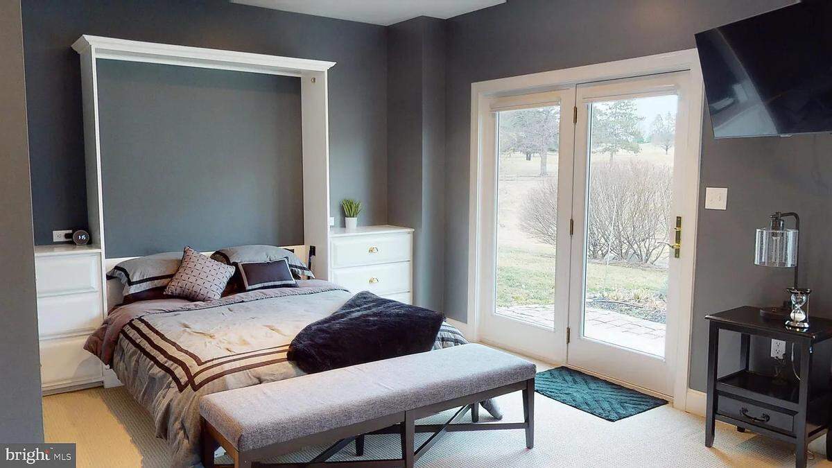 A bedroom with a walk-out door inside the home at 937 Greenbriar Drive. Photo shared with permission from home’s listing agent, Annette Yorks of Perry Wellington Realty.