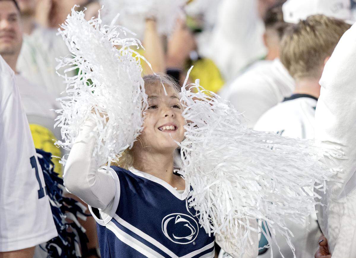 A young fan cheers during the Penn State White Out game against Oregon on Saturday, Sept. 27, 2025.  