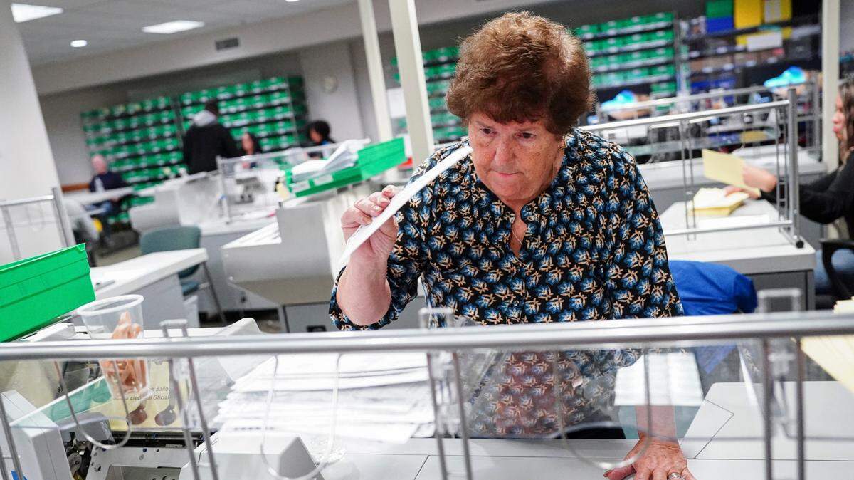 Voter registration worker Sharon Schoemaker sorts mail ballots at Lehigh County Government Center in Allentown, Pennsylvania on Nov. 7, 2023.