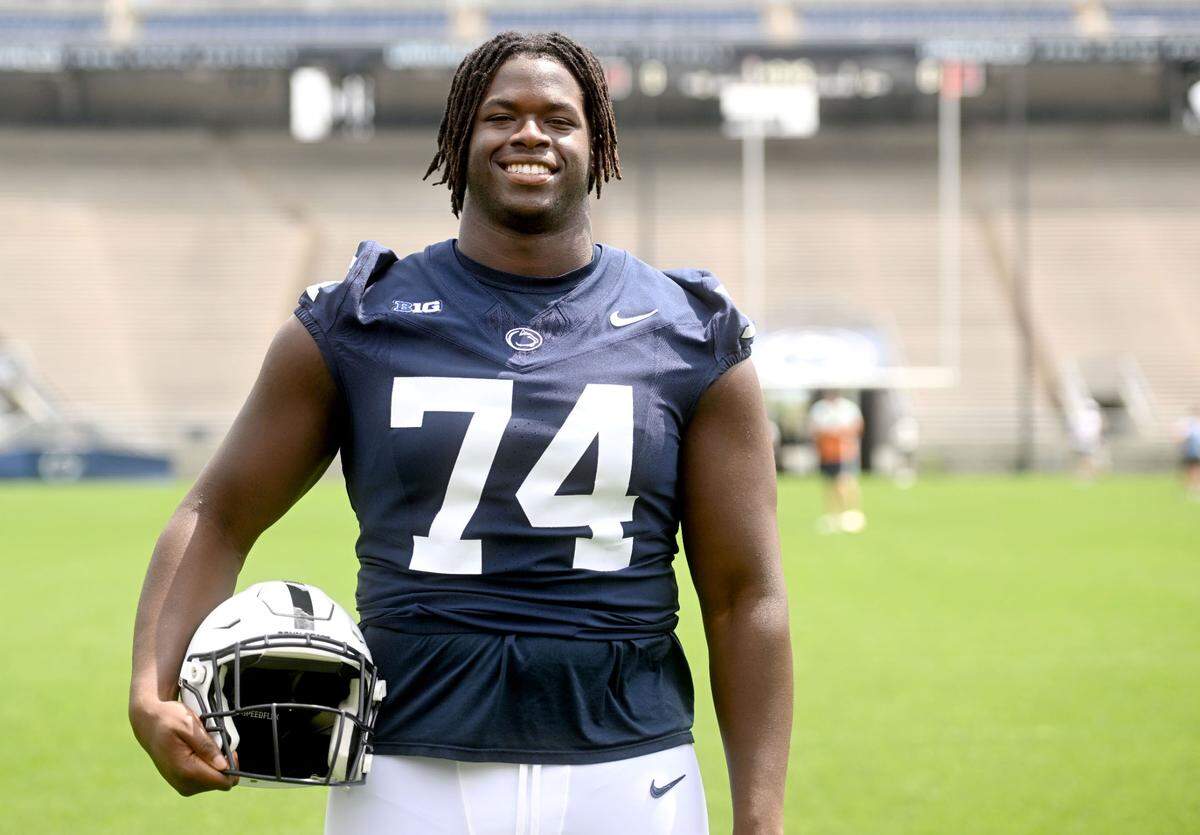 Penn State offensive lineman Olumuyiwa Fashanu poses for a photo during media day on Aug. 6, 2023 in Beaver Stadium.