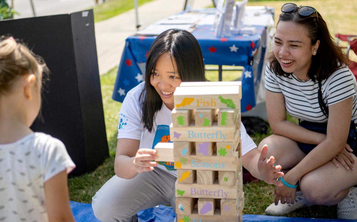 Chiew Ee Kwong and Tess Phan volunteer at the Citizen’s Climate Lobby booth on Friday, July 15, 2022. Phan from Vietnam and Kwong from Malaysia were in Centre County through the Young Southeast Asian Leaders Initiative Fellows Program.