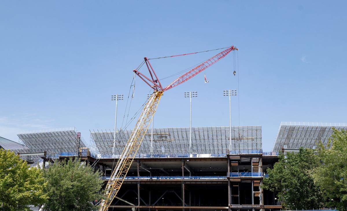 The temporary stands and lights are being installed on the west side of Beaver Stadium on Tuesday, July 29, 2025.  