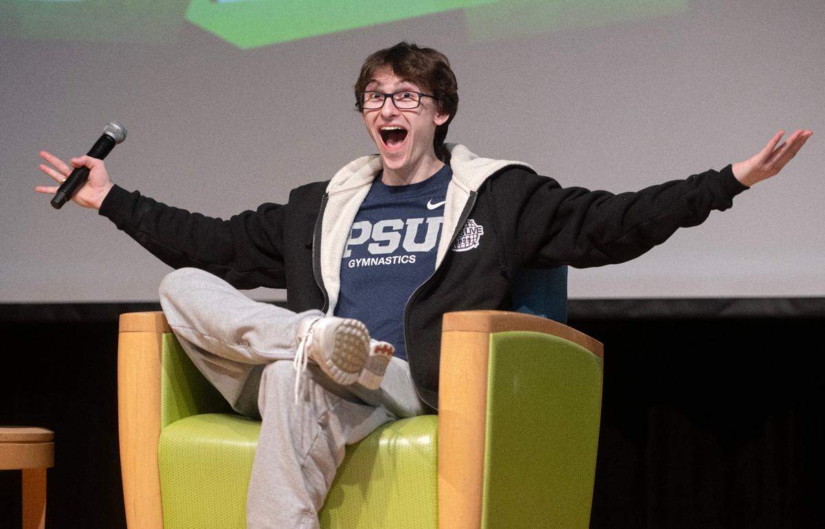 Gymnast Stephen Nedoroscik gestures to the crowd as he talks about winning at the world championships in 2021 during a visit to Penn State on Thursday, Jan. 23, 2025.