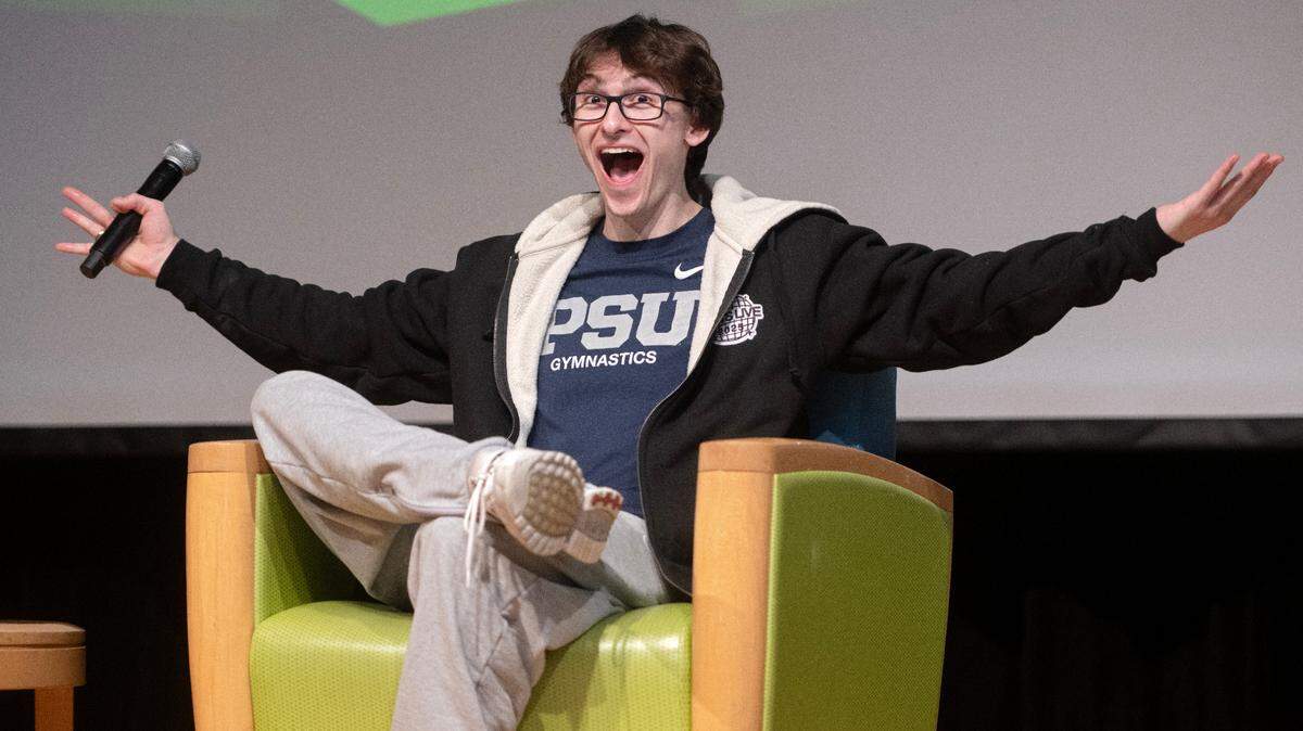 Gymnast Stephen Nedoroscik gestures to the crowd as he talks about winning at the world championships in 2021 during a visit to Penn State on Thursday, Jan. 23, 2025.