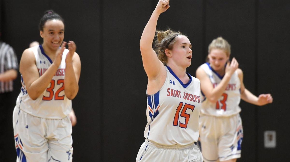 Saint Joseph’s Maggie Mangene celebrates the 55-46 win over Blacklick Valley in the District 6 A consolation game on Tuesday, Feb. 26, 2019 at Tyrone High School.