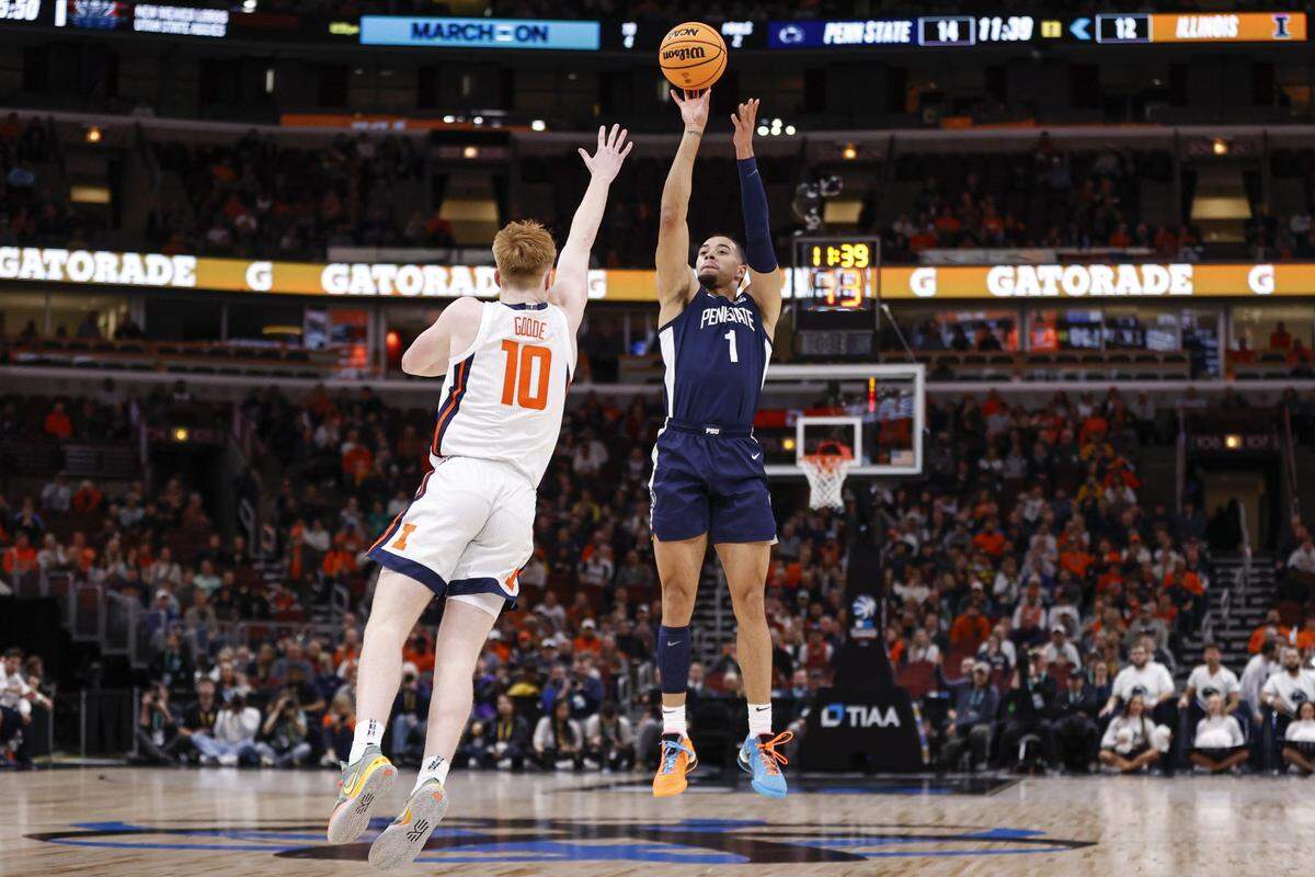 Penn State Nittany Lions guard Seth Lundy (1) shoots against Illinois Fighting Illini guard Luke Goode (10) during the first half of Thursday’s game at United Center.