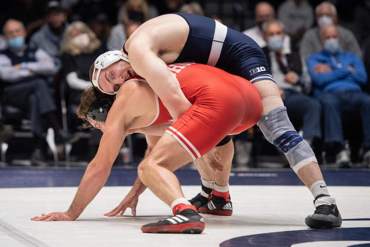 Penn State’s Michael Beard wrestles Nebraska’s Eric Schultz during an NCAA wrestling dual between No. 1 Penn State and No. 8 Nebraska at Rec Hall on Sunday. Penn State defeated Nebraska 21-13 and claimed the Big Ten Regular Season Dual Meet Championship.