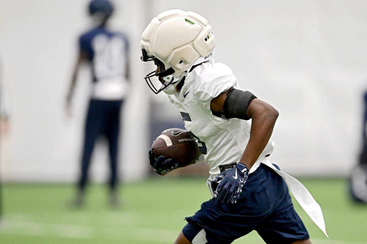 Penn State wide receiver Devonte Ross runs with the ball after making a catch during practice on Wednesday, Oct. 29, 2025. 