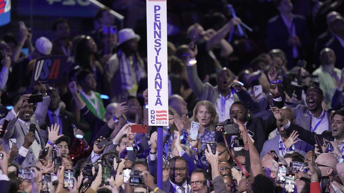 Aug 20, 2024; Chicago, IL, USA;  Pennsylvania Gov. Josh Shaprio joins state delegates as they cast their votes in the ceremonial roll call  during the second day of the Democratic National Convention at the United Center.    Mandatory Credit: Mark Hoffman-USA TODAY