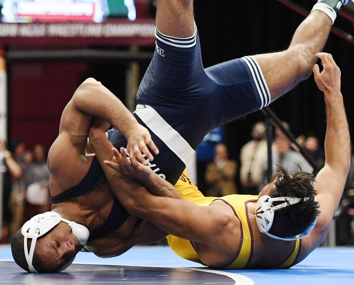 Penn State’s Mark Hall scrambles with Arizona State’s Zahid Valencia in the 174-pound finals in the NCAA Division I Wrestling Championships Saturday, March, 17, 2018 at the Quicken Loans Arena in Cleveland, Ohio.