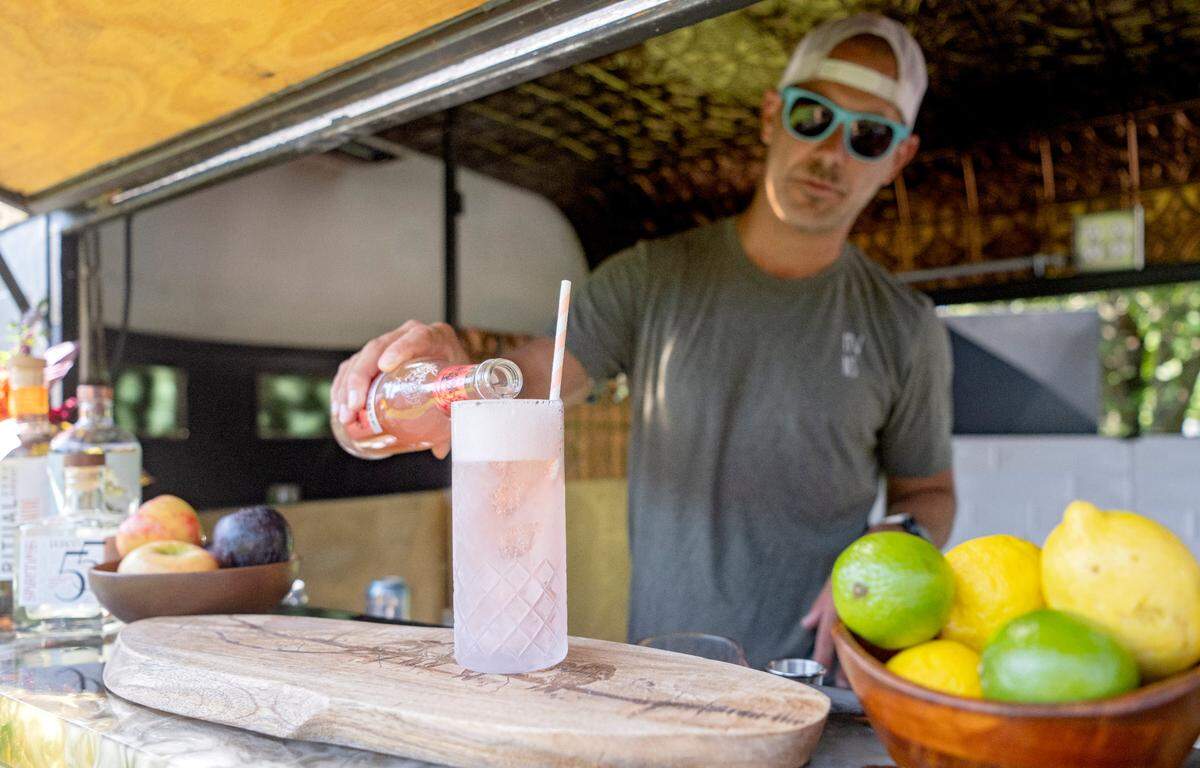 Mike Tedesco makes a non-alcoholic Paloma in Nellie the Mobile Mocktail Bar on Tuesday, Sept. 12, 2023.
