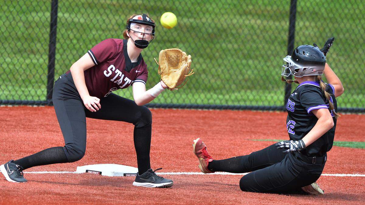 State College third baseman Meredith Meengs takes the throw and makes a late tag on Mifflin County’s Dakota Hershberger during the District 6 6A title championship game Wednesday, May 25, at St. Francis University.