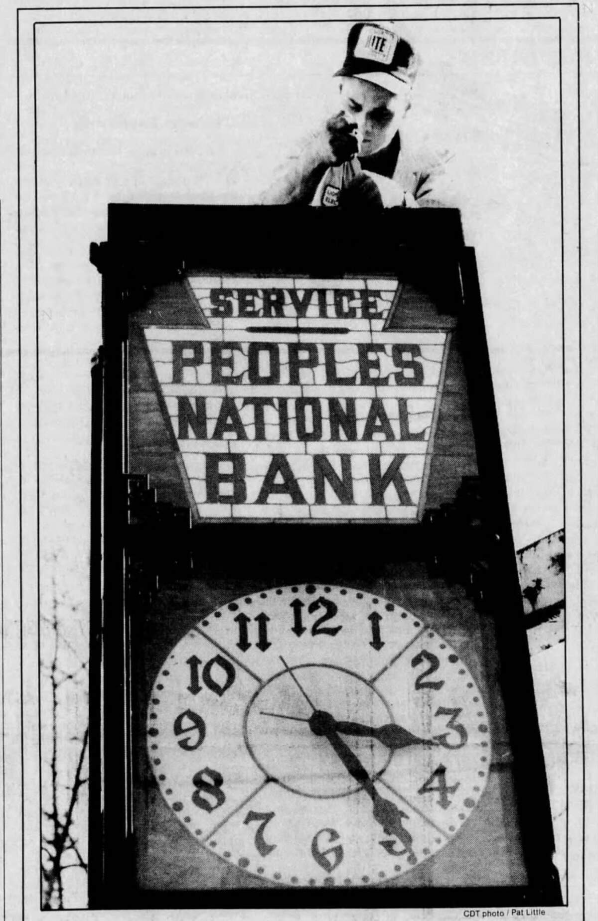 Darrin Hayward of Osceola Mills, employed at the time by Lion Electric Company, repairs the chimes in the Peoples National Bank clock in this picture, published in the Centre Daily Times in 1989.