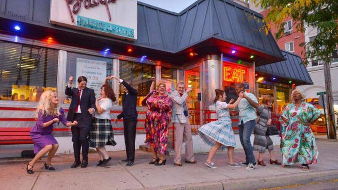 The cast of State College Community Theatre’s production of “Hairspray” pose in front of Baby’s Burgers and Shakes. The show is set in 1960s Baltimore.
