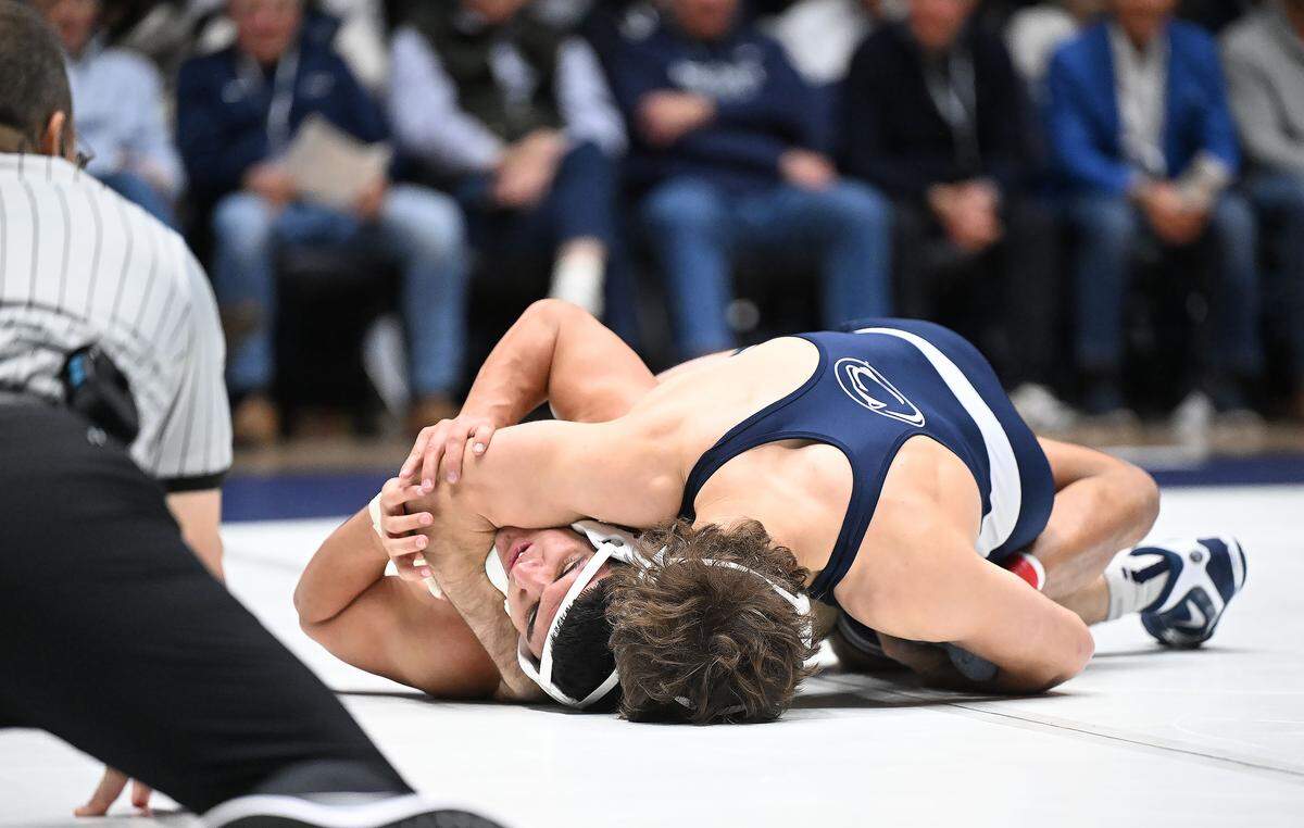 Penn State's Levi Haines (top) takes down Lehigh's Bekhurz Sadriddinov enroute to a pin fall at 174 pounds during the Sunday, Dec. 7, 2025 at Rec Hall in State College. 