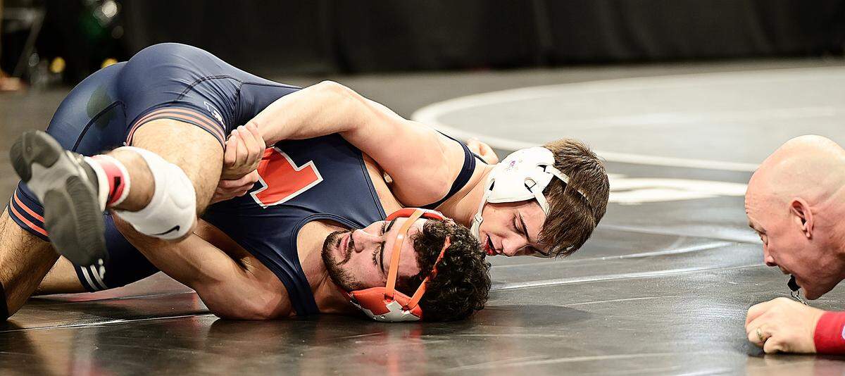 Penn State’s Luke Lilledahl looks to pin Illinois’ Caelan Riley in their 125-pound first round match of the Big Ten Championships on Saturday in Welsh Ryan Arena in Evanston, Ill. Lilledahl did get the fall in 4:09.