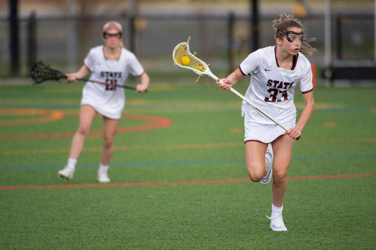 State College’s Sydney O’Donnell runs to the goal during a lacrosse game between State High and Chambersburg on Thursday.