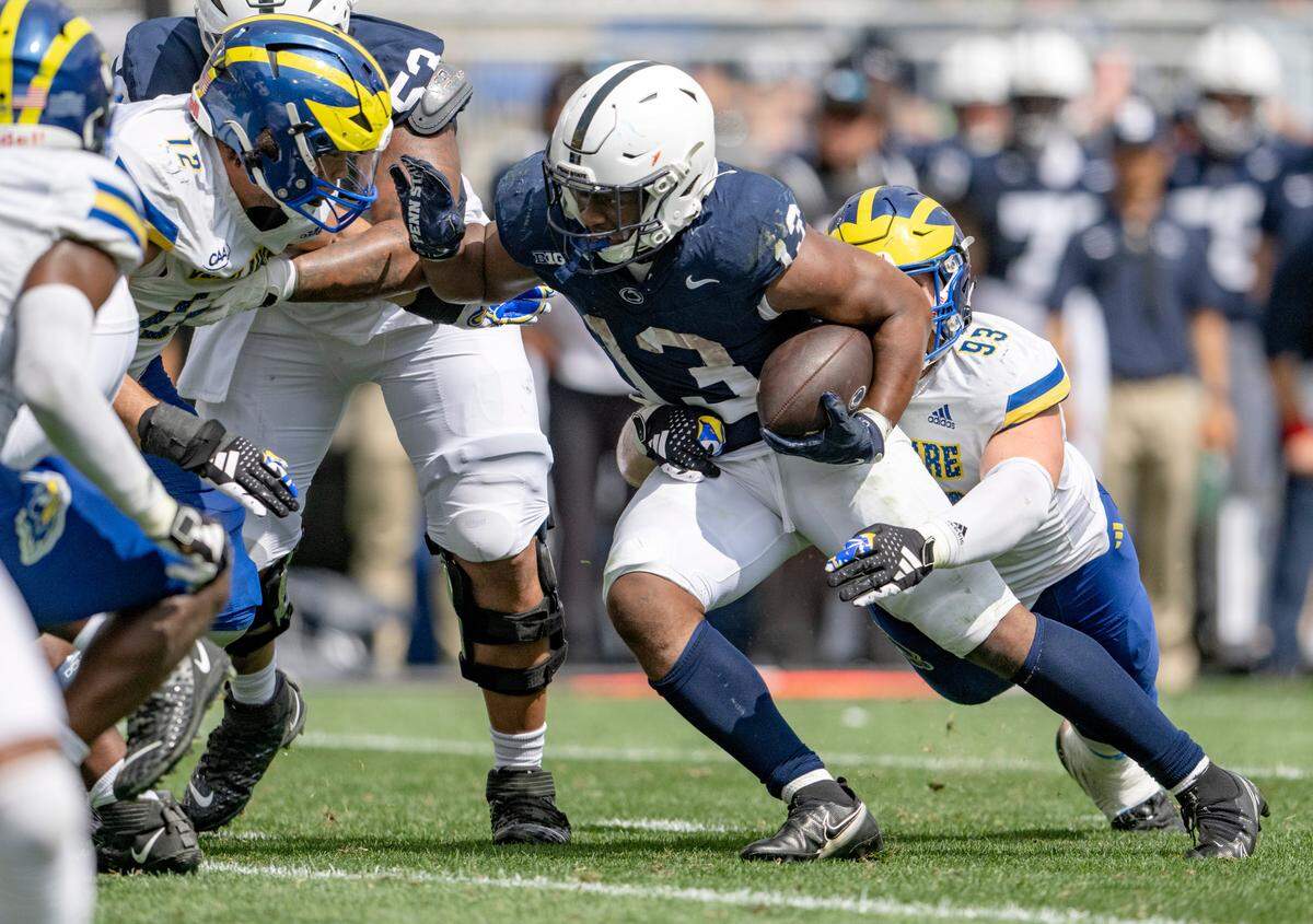 Delaware defenders can’t stop Penn State running back Kaytron Allen during the game on Saturday, Sept. 9, 2023.