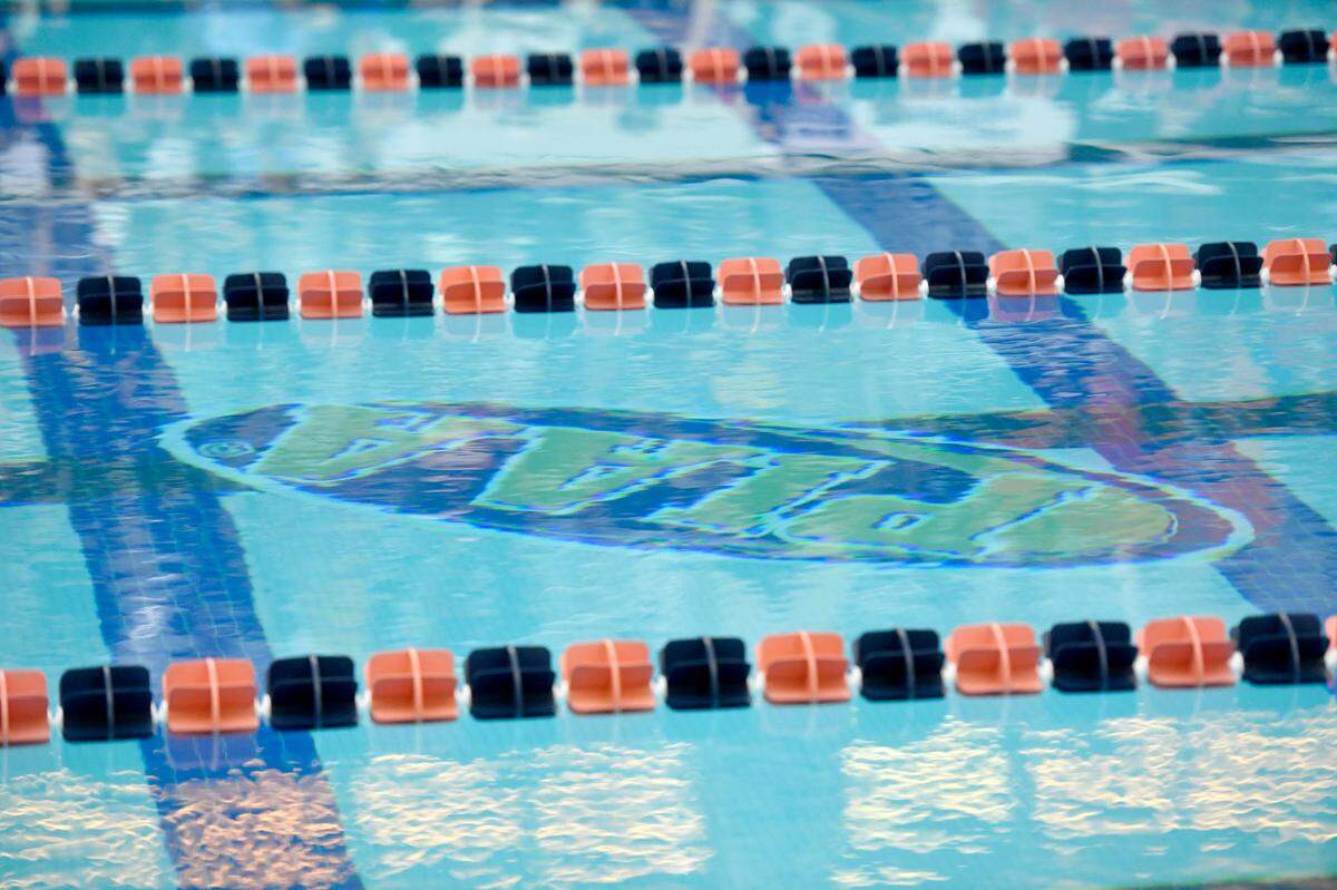 The PIAA logo is reflected in the pool at swimming championships at Bucknell in March 2022.