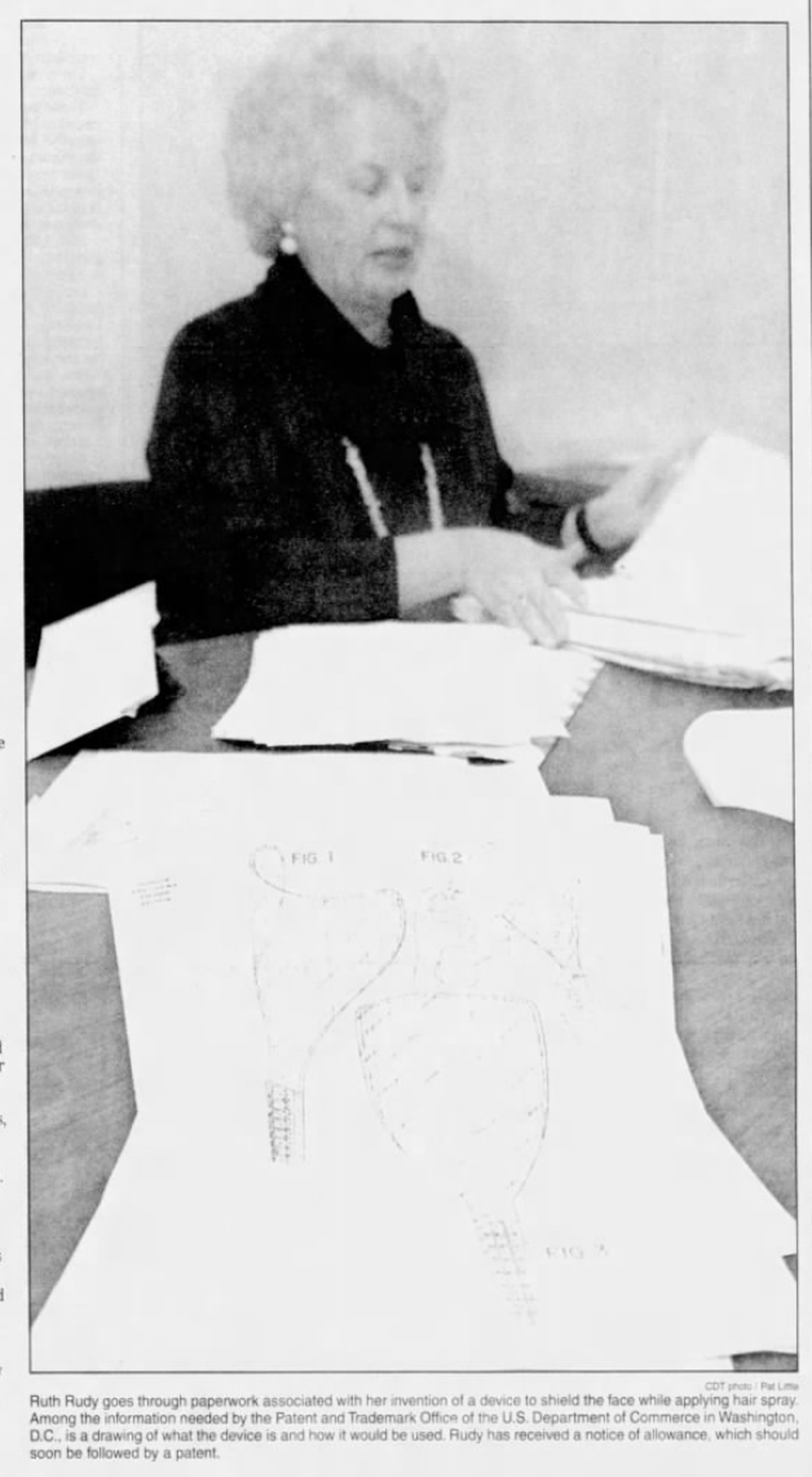 A photo from the Dec. 1, 1994 Centre Daily Times shows Ruth Rudy’s paperwork about a device she invented to shield the face while applying hairspray. Rudy died March 28, 2025.