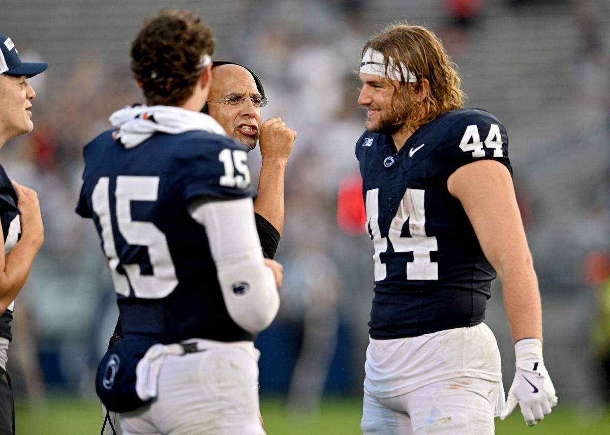 Penn State football coach James Franklin talks to quarterback Drew Allar and tight end Tyler Warren during the game against Kent State on Saturday, Sept. 21, 2024 at Beaver Stadium.