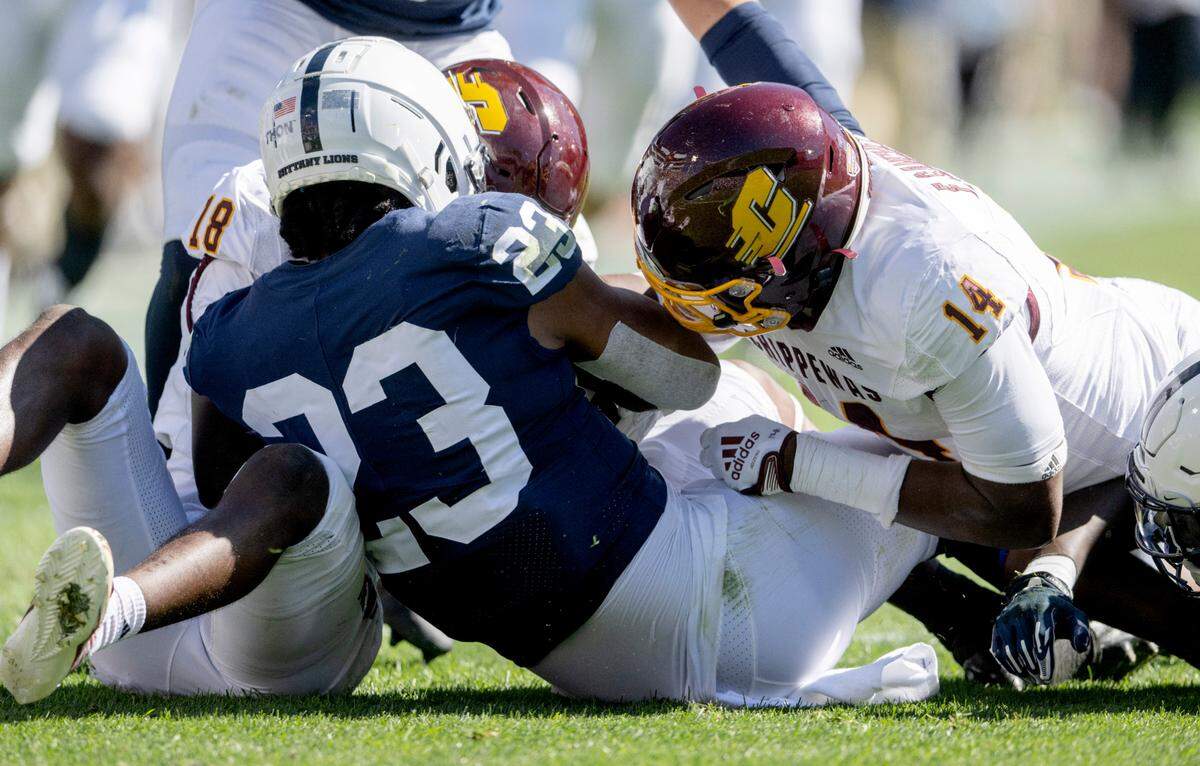 Penn State linebacker Curtis Jacobs grabs the ball that was fumbled on a punt during the game on Saturday, Sept. 24, 2022.