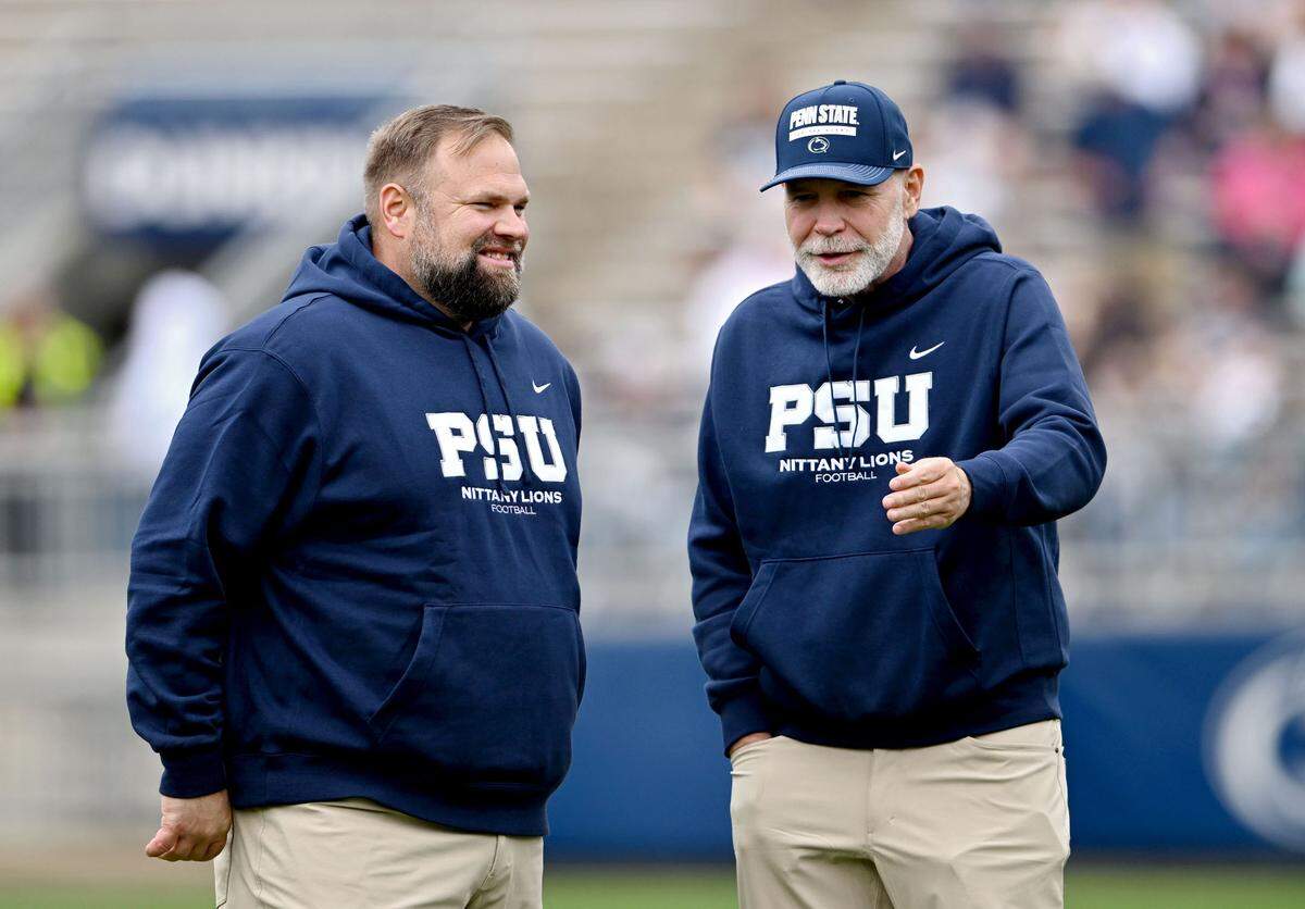 Penn State offensive coordinator Andy Kotelnicki and defensive coordinator Jim Knowles chat before the Blue-White game on Saturday, April 26, 2025.