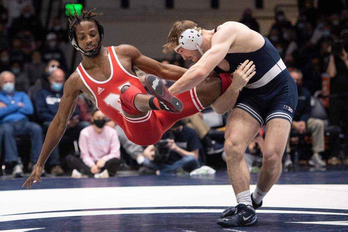 Penn State’s Creighton Edsell sweeps the leg of Nebraska’s Tahjae Jenkins-Harris during an NCAA wrestling dual between No. 1 Penn State and No. 8 Nebraska at Rec Hall on Sunday. Penn State defeated Nebraska 21-13 and claimed the Big Ten Regular Season Dual Meet Championship.