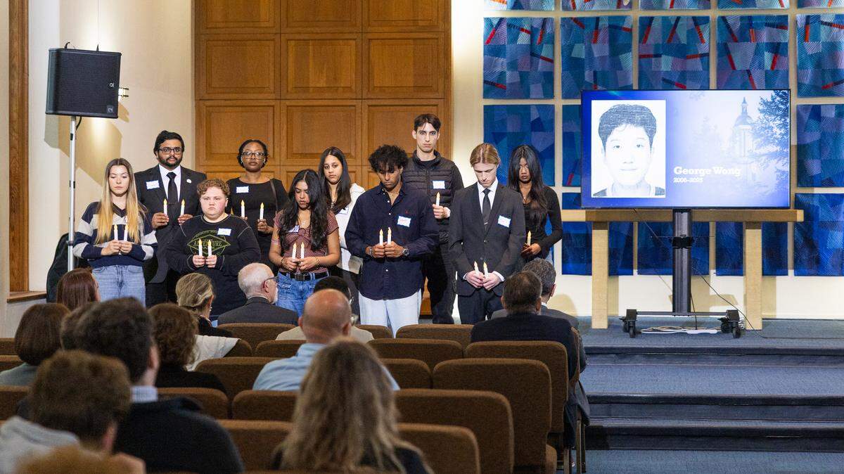 Students hold candles during the Night of Remembrance inside Eisenhower Chapel on Thursday, April 30, 2026. The event was hosted by student government organizations in honor of Penn State students and faculty who died during the 2025-26 school year.