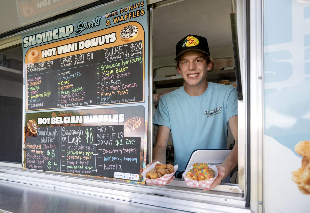 Gavin Guenot of Snowcap Sweets: By Mountaintop Concessions with an order of cin-bun and Fruity Pebbles mini donuts on Thursday, July 9, 2026.