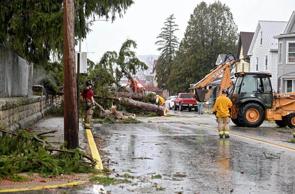 Firefighters and Bellefonte Borough work to clear a tree that came down on the 400 block of East Bishop Street after severe storm on Sunday, March 16, 2025.