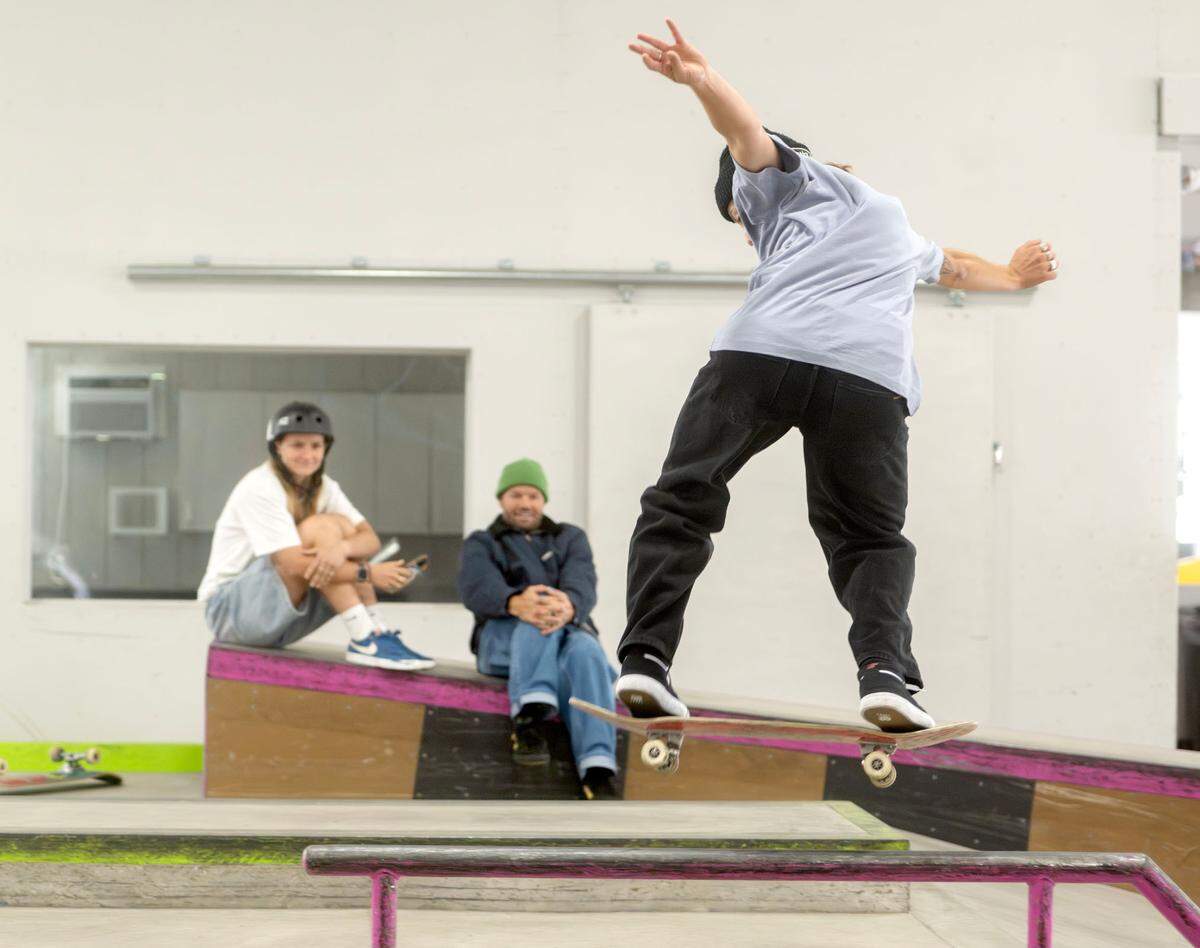 Liv Lovelace works on kickflip back slide lipslide as Beau Mitchell and Felicity “Flic” Turner cheer her on at Woodward on Wednesday, April 24, 2024. Lovelace and Turner are part of the Australian national skateboarding team that Mitchell coaches.