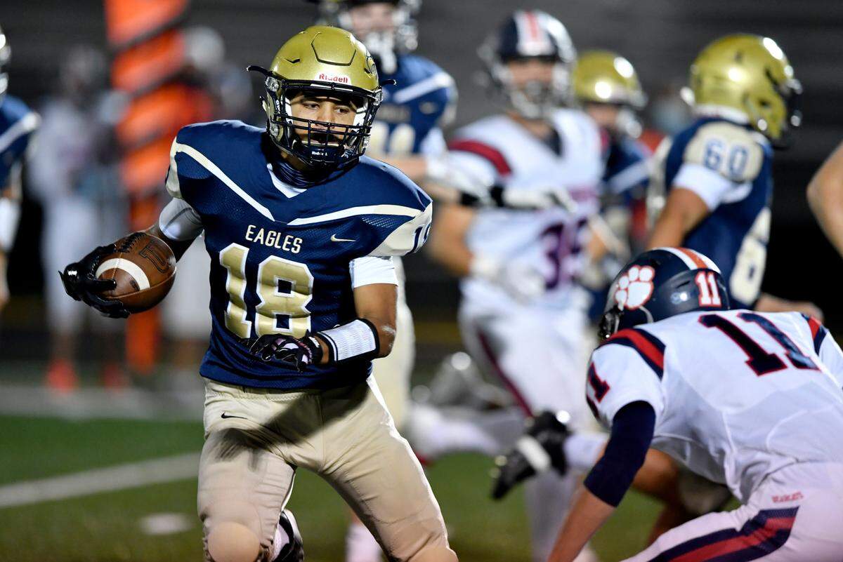 Bald Eagle AreaÕs Camron Watkins cuts around Huntingdon defenders for a touchdown during the win on Friday, Sept. 18, 2020