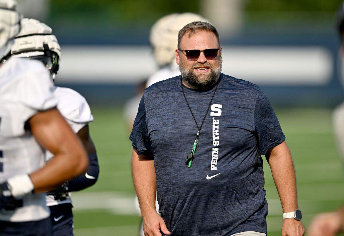Penn State offensive coordinator Andy Kotelnicki yells to the players as they move between drills at practice on Wednesday, July 31, 2024.
