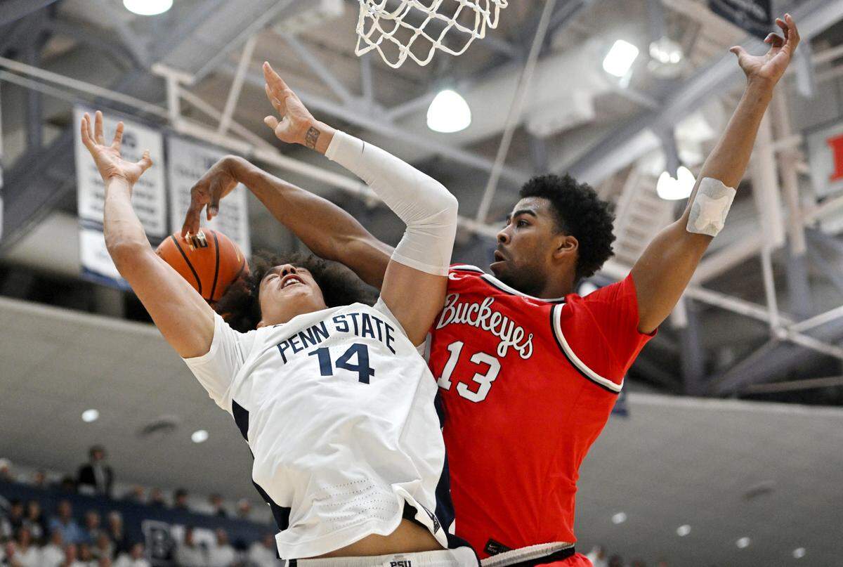 Ohio State’s Sean Stewart hits the ball away from Penn State’s Yanic Konan Niederhauser during the game on Thursday, Jan. 30, 2025 at Rec Hall.