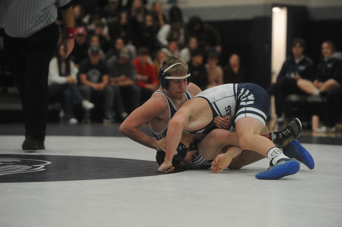 Philipsburg-Osceola’s Nate Fleck aims to finish off a takedown of Penns Valley’s Chase Fleshman in their 145-pound bout of the Mounties’ 51-14 loss on Tuesday, January 17, 2023. Fleck shut out Fleshman, 9-0.