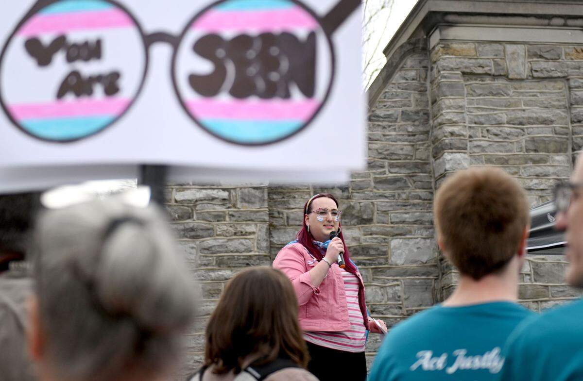 Michel Lee Garrett speaks during the Centre LGBT+’s Transgender Day of Visibility celebration at the Allen Street gates on Monday, March 31, 2025.