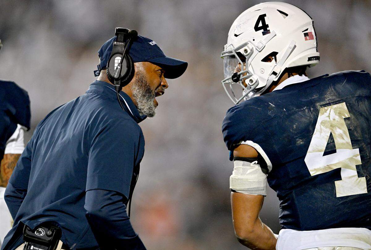 Penn State cornerbacks coach Terry Smith talks to A.J. Harris after a play during the game against Illinois on Saturday, Sept. 28, 2024.  