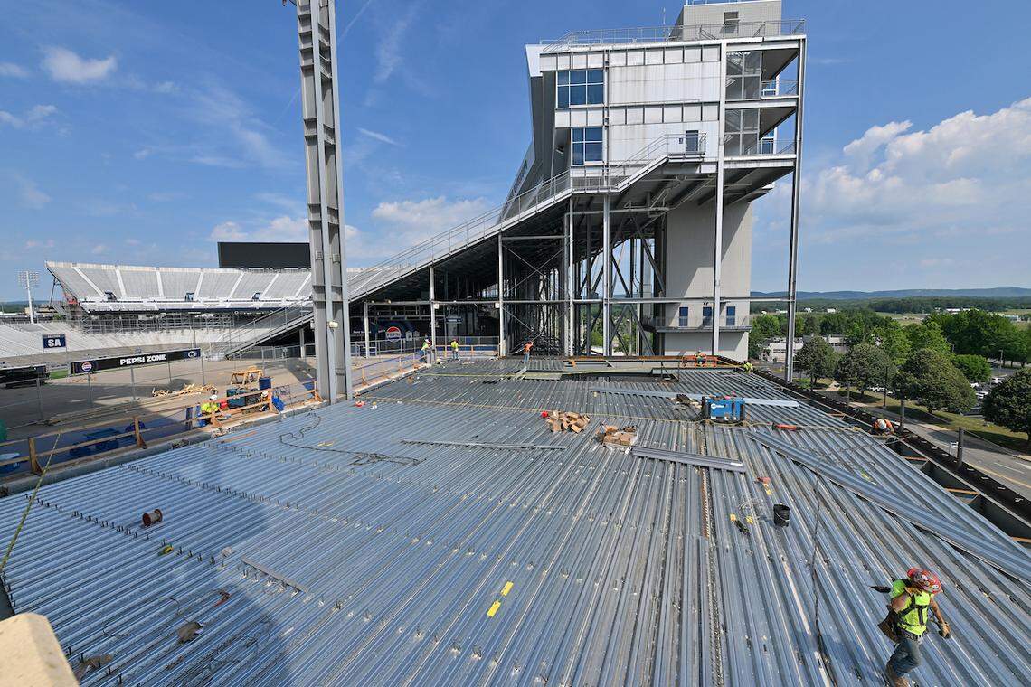 Construction crews work on the east side of Beaver Stadium during July. This round of projects is expected to be complete by the start of the football season.