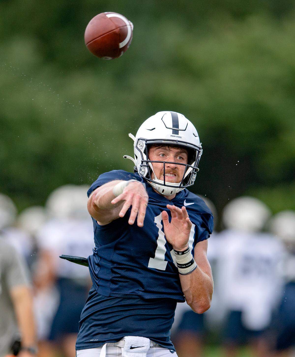 Penn State quarterback Sean Clifford makes a pass during practice on Wednesday, Aug. 11, 2021.