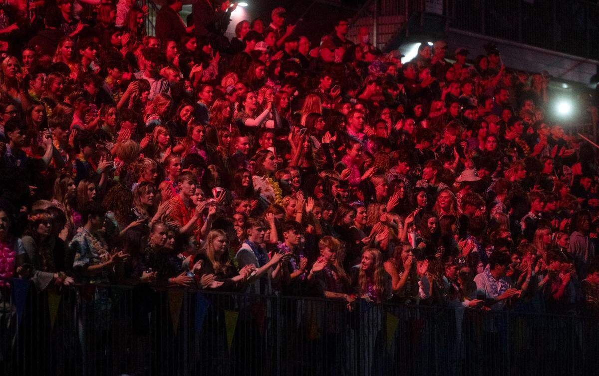The State College student section glows red as the team is in the red zone during the game against Altoona on Friday, Sept. 15, 2023.