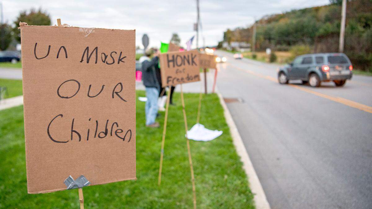 Community members protest mask mandates outside of Bald Eagle Area high school on Friday, Oct. 22, 2021.