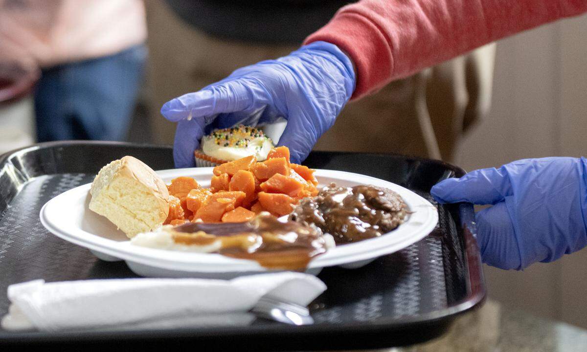 Volunteers from Watermarke Church help serve lunch to those in need during the Bellefonte Community Lunch Program on Wednesday, Nov. 19, 2025 at Trinity UMC. 