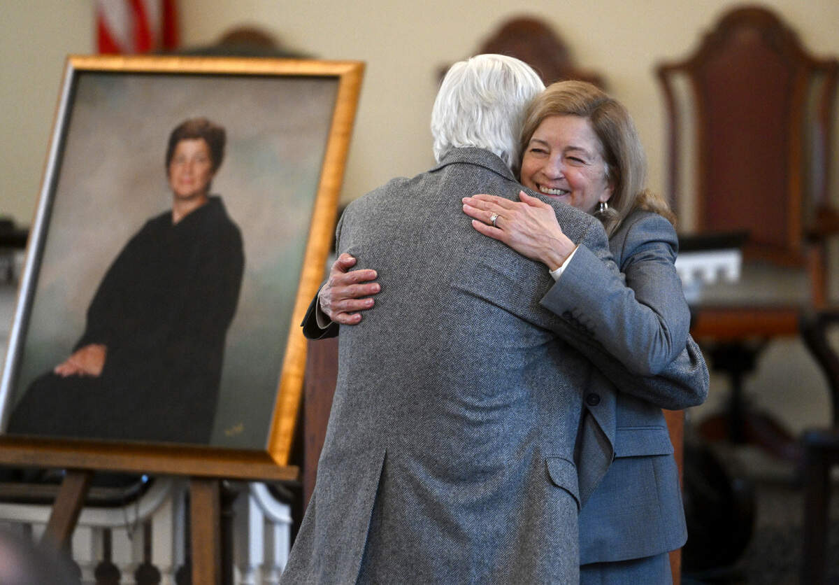 Centre County President Judge Pamela A. Ruest hugs her husband, Jeff Jones, during her retirement celebration on Tuesday, Dec. 13, 2022.