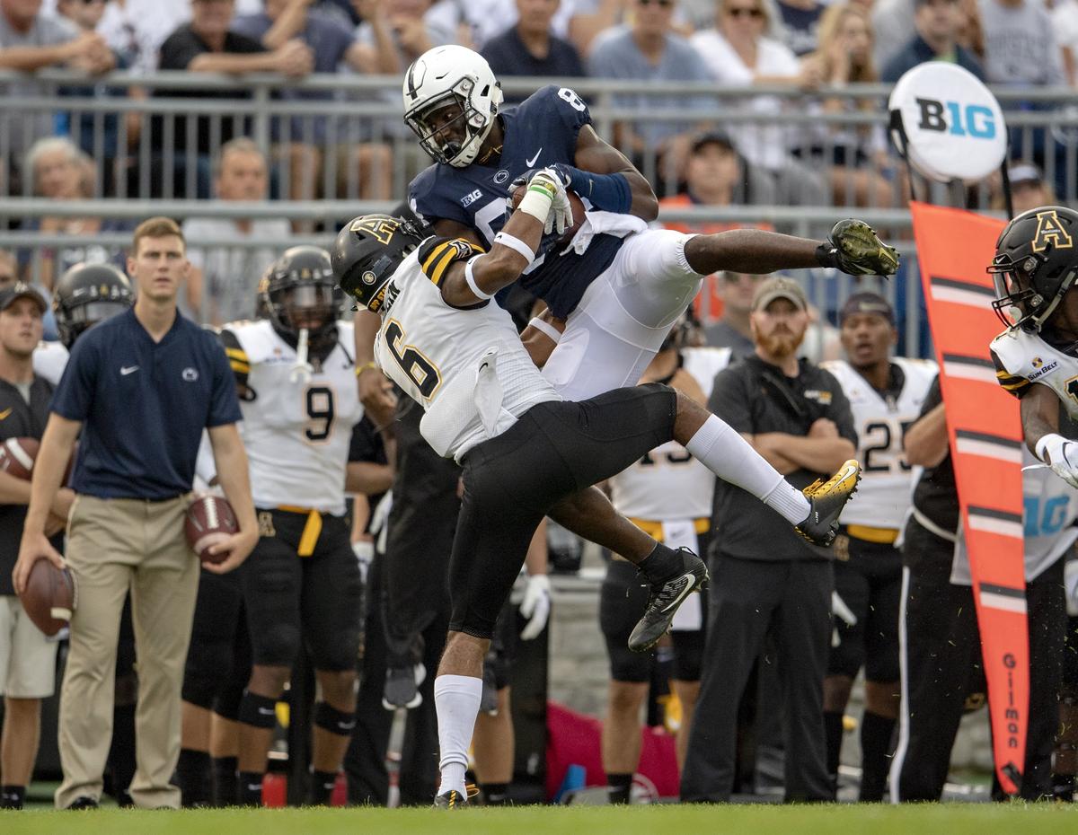 Penn State wide receiver Juwan Johnson makes a catch for a first down over Appalachian State defensive back Desmond Franklin during the Saturday, Sept. 1, 2018 game at Beaver Stadium.