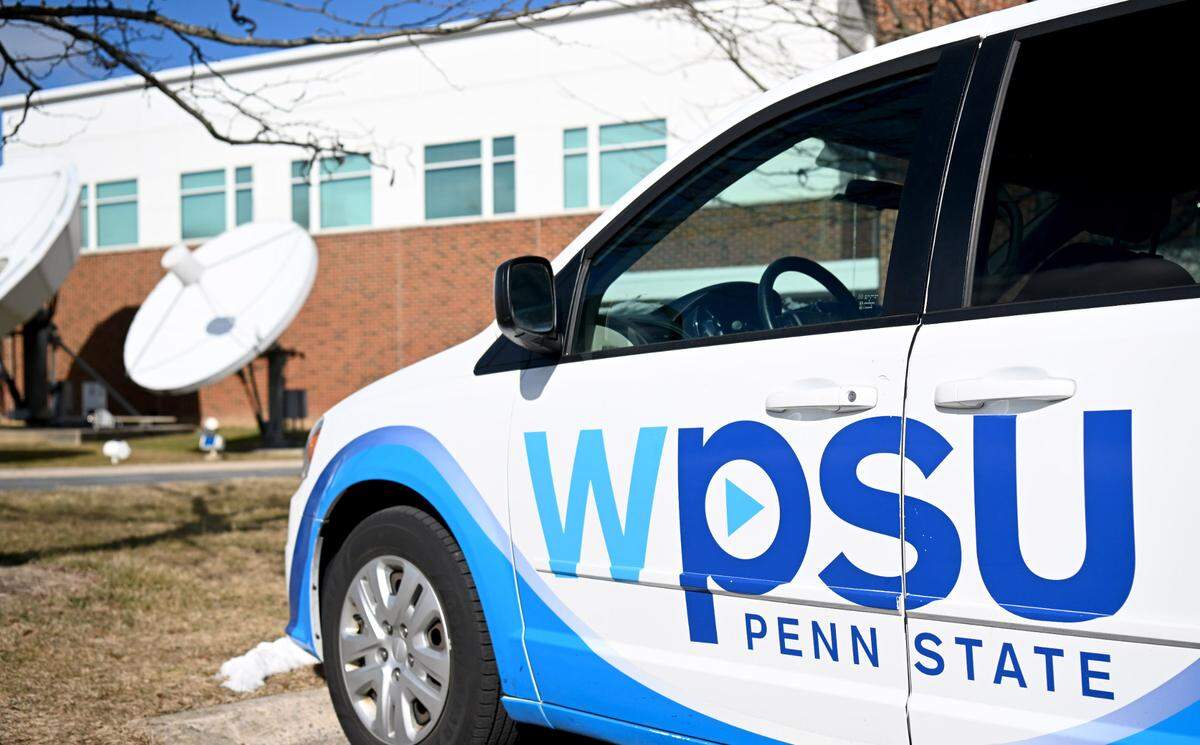 A WPSU van and the broadcast satellites outside of 100 Innovation Boulevard.